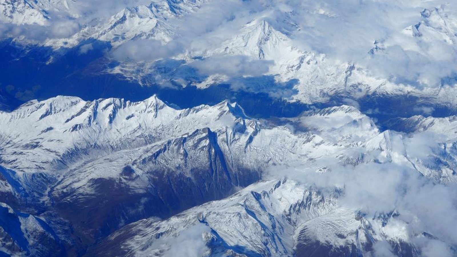 Snow-covered mountain ridges photographed from high above